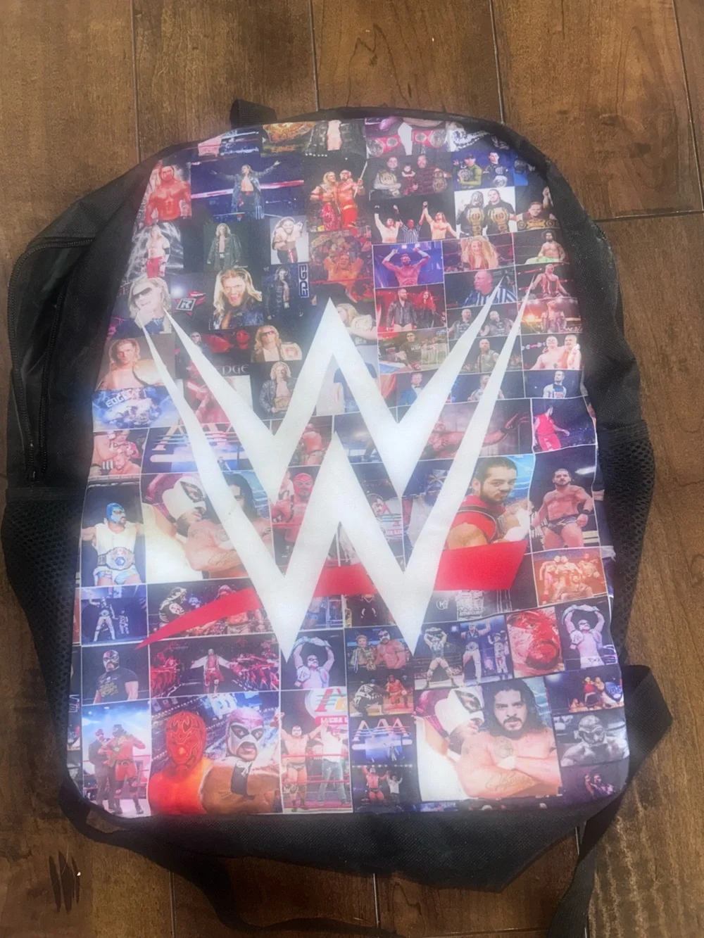 WWE  Logo Collage Backpack - Black and Multicolor. Never used